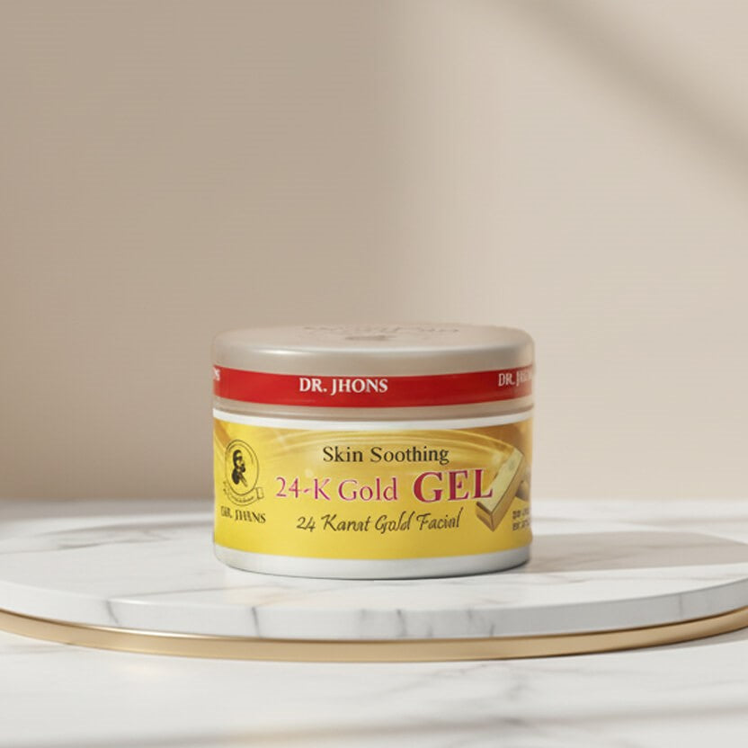 Jar of Dr. Jhons 24-K Gold Gel on a marble surface with a beige background